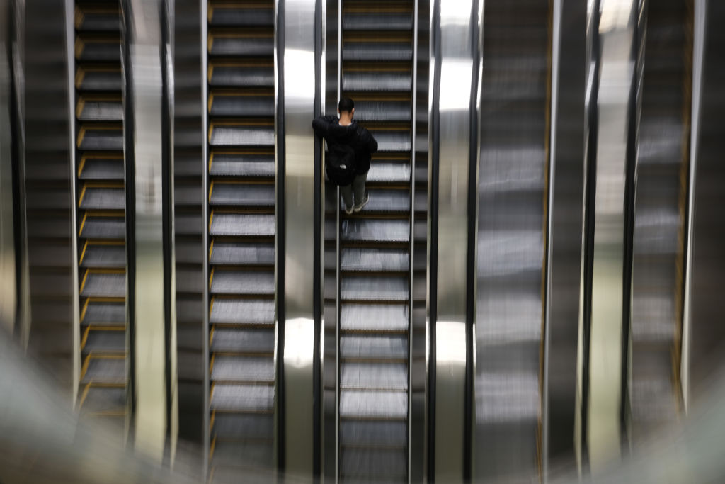 People ride the escalator in the newly opened Grand Central Madison train terminal, as seen February 2023 in New York City. (Photo by Spencer Platt/Getty Images)