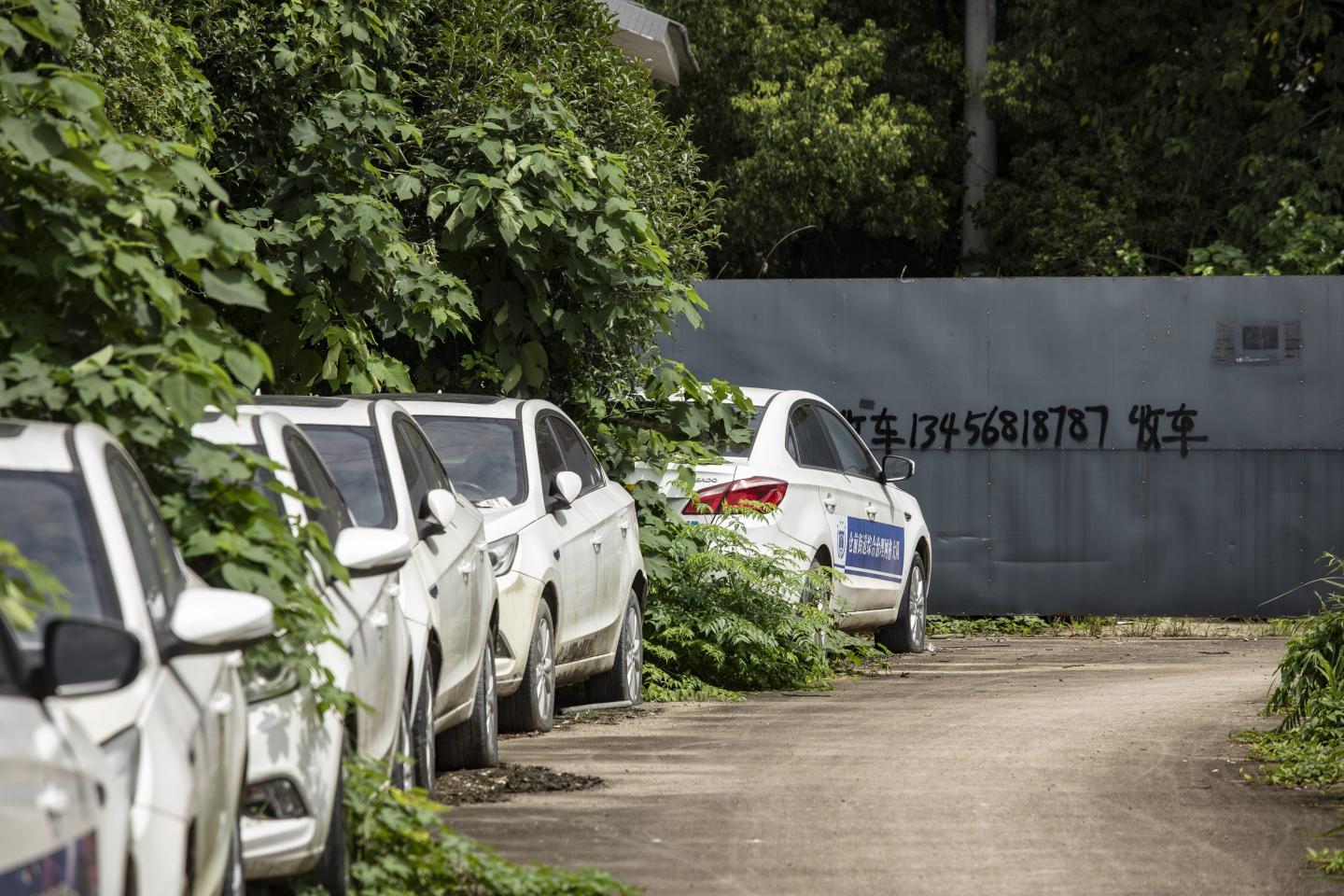 No one wants to buy used EVs and they’re piling up in weed-infested graveyards