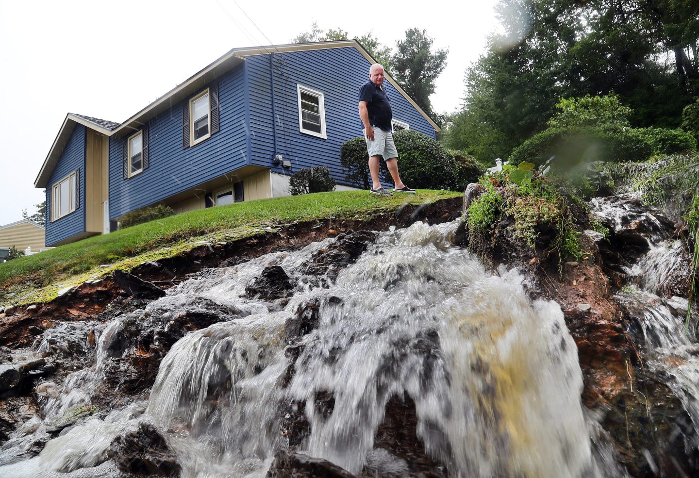 Heavy rainfall created a waterfall in this backyard in Leominster, Mass.