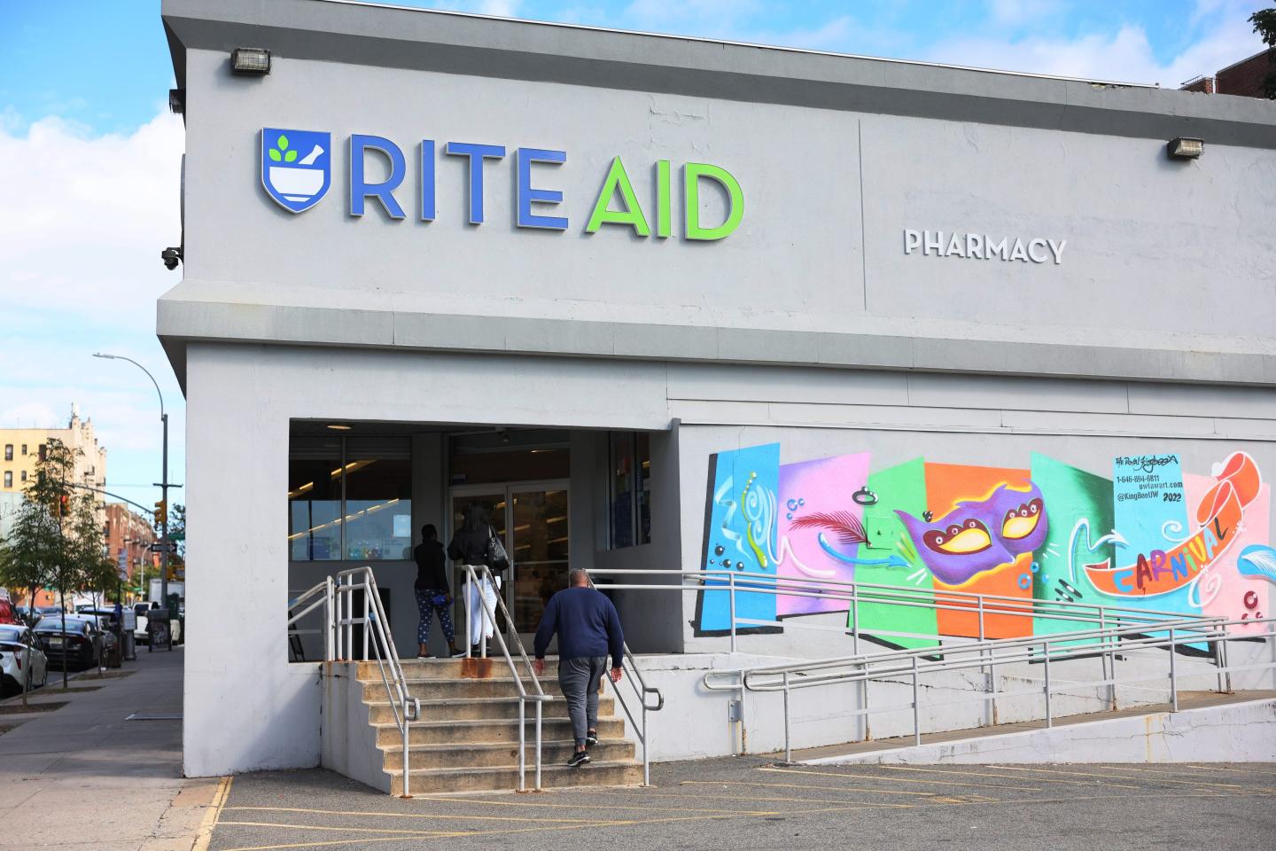 People enter a Rite-Aid on October 16, 2023 in the Crown Heights neighborhood of the Brooklyn borough of New York City.