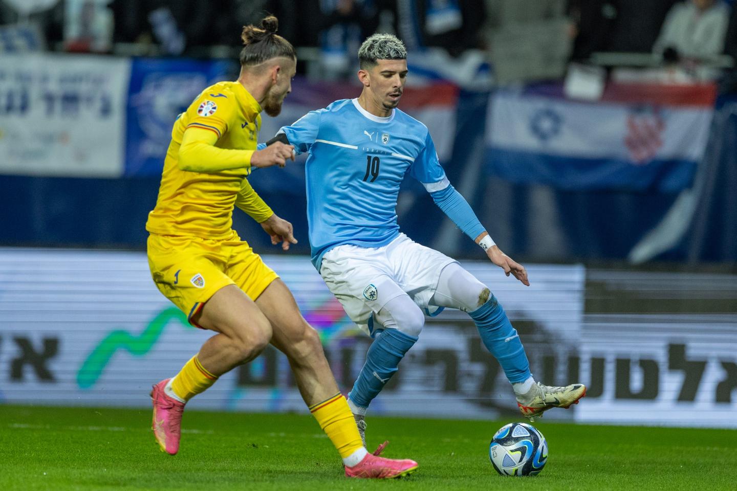 Radu Dragusin of Romania tries to stop Dor Turgeman of Israel