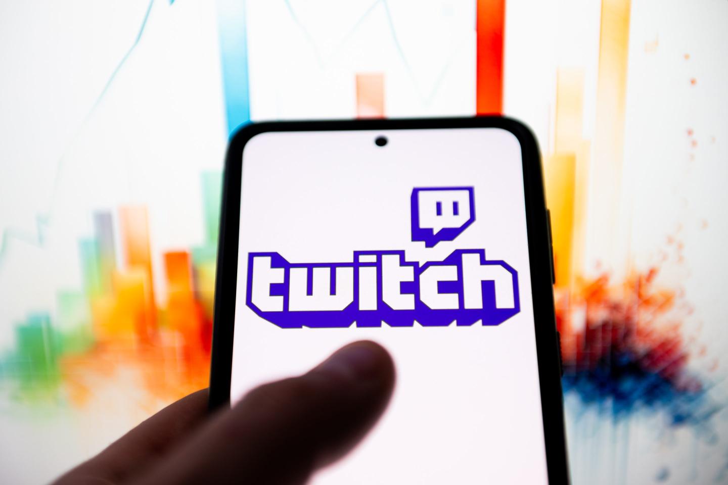 In this photo illustration a Twitch logo seen displayed on a smartphone.