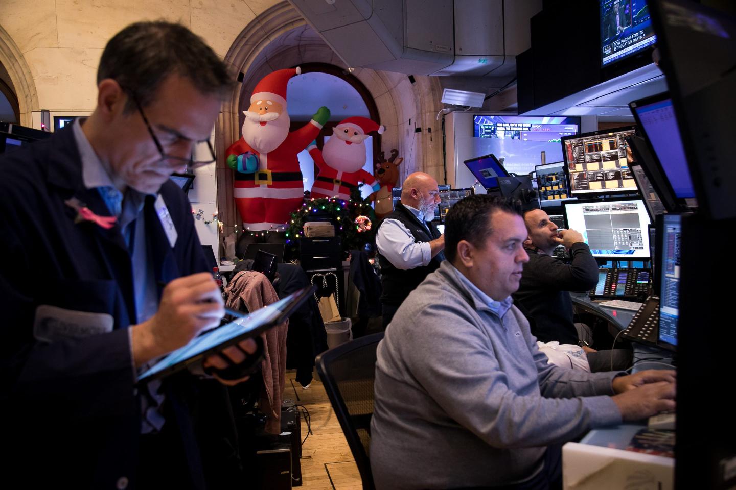Traders work on the floor of the New York Stock Exchange