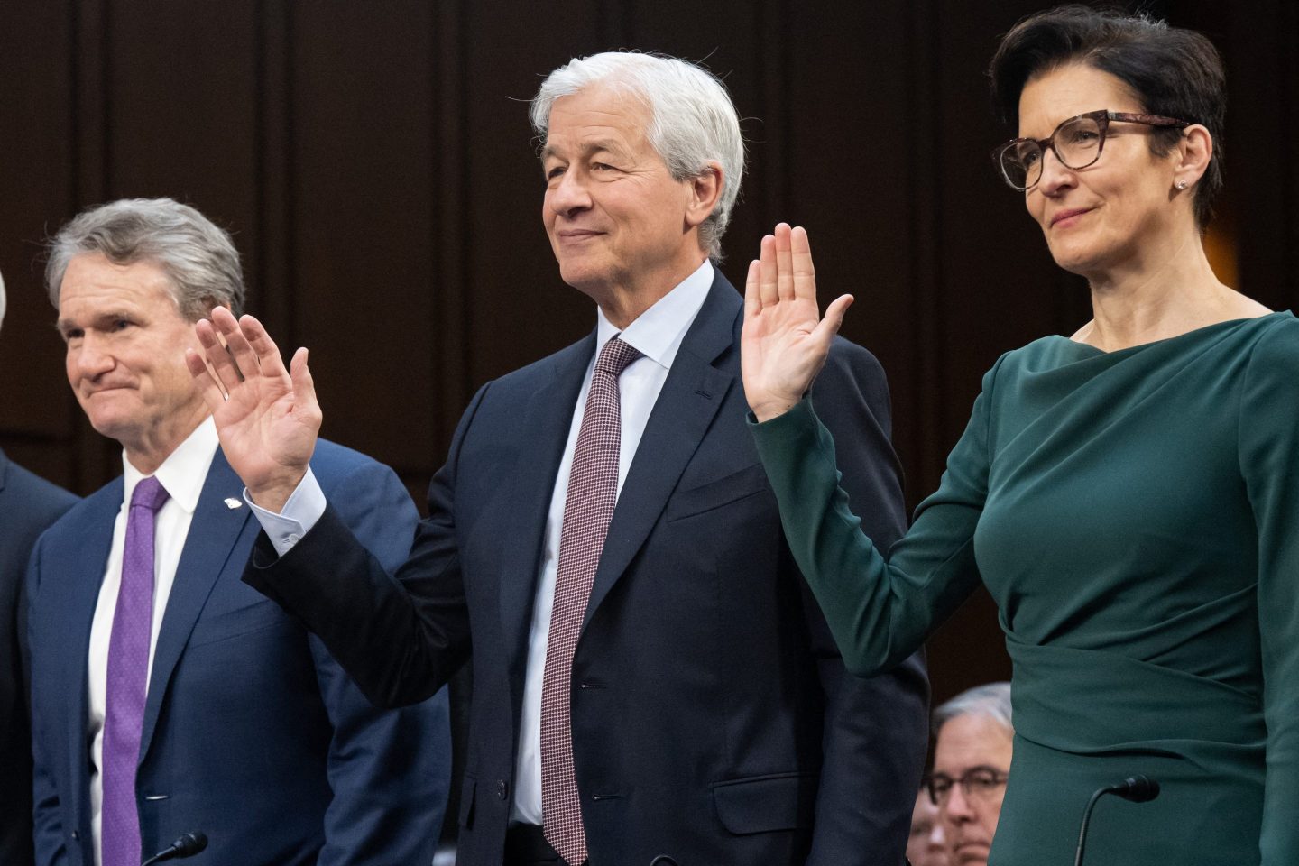 Bank of America CEO Brian Moynihan, JPMorgan Chase CEO Jamie Dimon, and Citigroup CEO Jane Fraser raise their hand and take an oath before testifying to the Senate banking committee.
