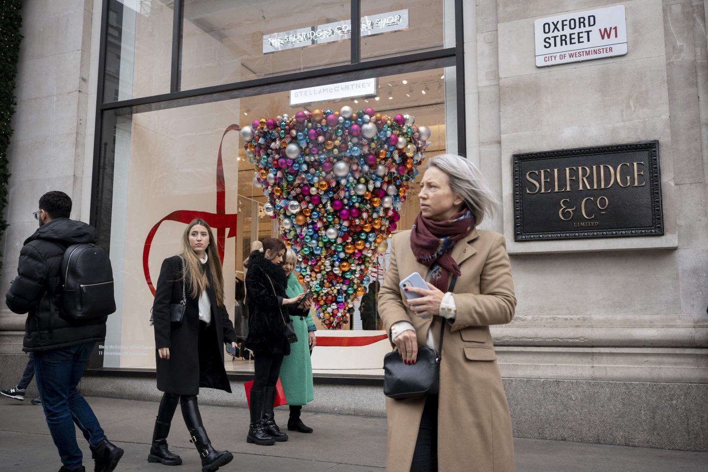 Christmas shoppers outside the Selfridges department store on Oxford Street on 20th December 2023, in London, England.