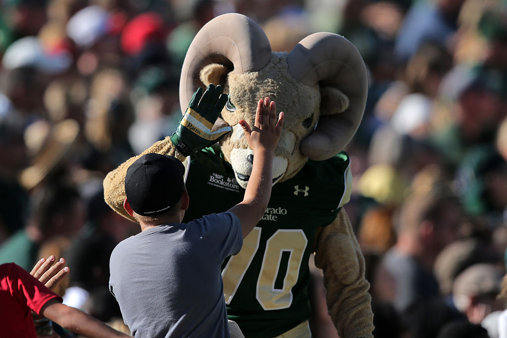 Cam the Ram celebrates with a fan as they support the Colorado State Rams against the Minnesota Golden Gophers at Sonny Lubick Field at Hughes Stadium, as seen in September 2015 in Fort Collins, Colorado. (Photo by Doug Pensinger/Getty Images)