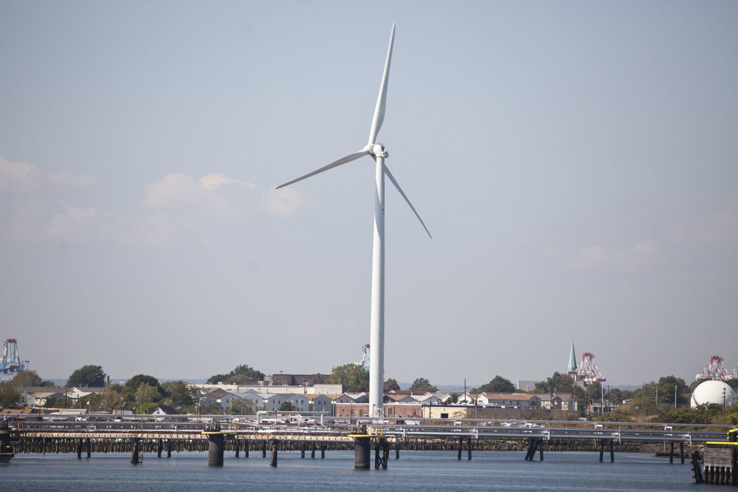 A wind turbine is placed off the coast in Newark Bay in Elizabeth, New Jersey