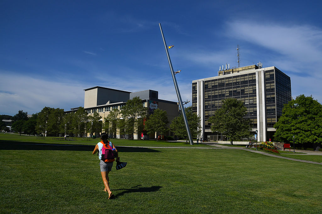 A student walks across The Cut on the campus of Carnegie Mellon University, as seen in August 2016. (Photo by Katherine Frey—The Washington Post/Getty Images)