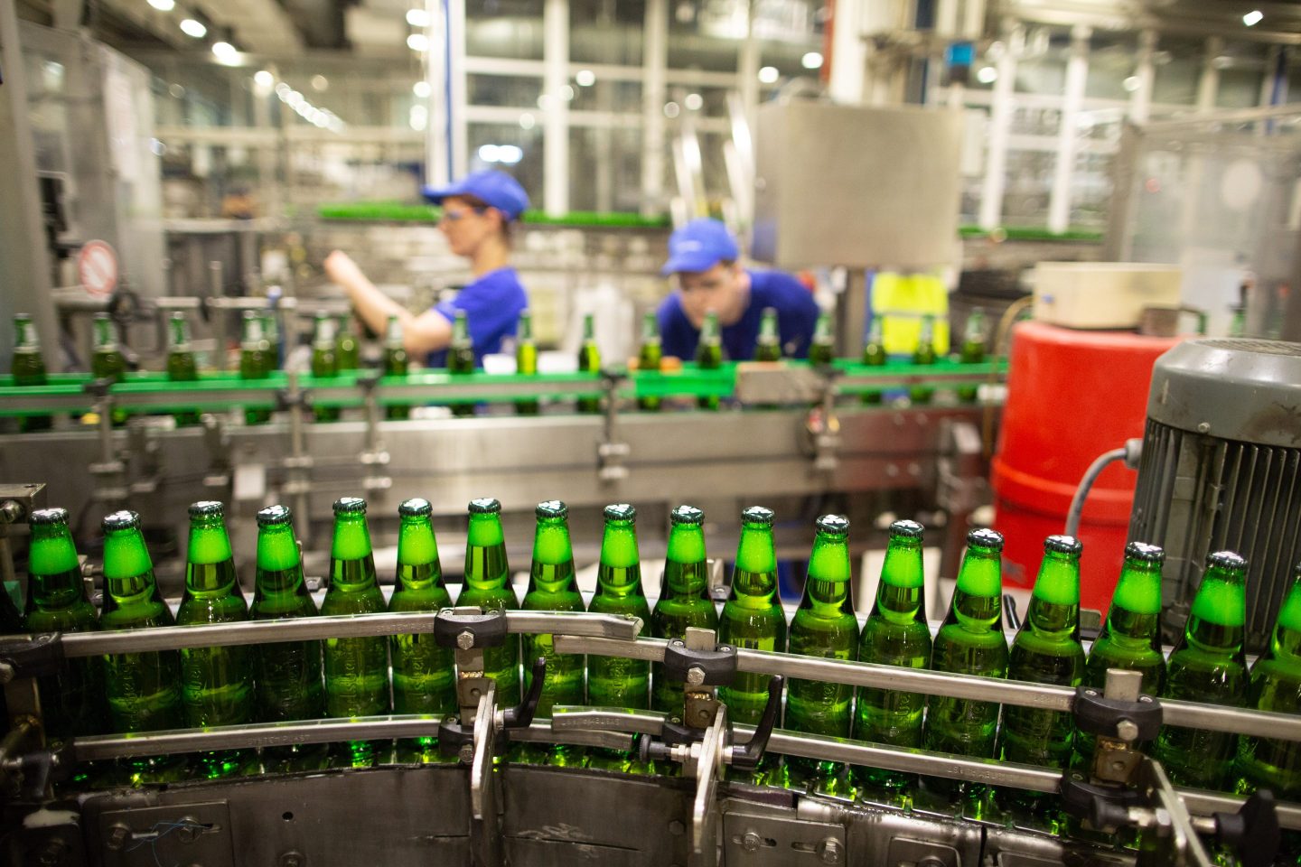 bottles of beer in a factory machine