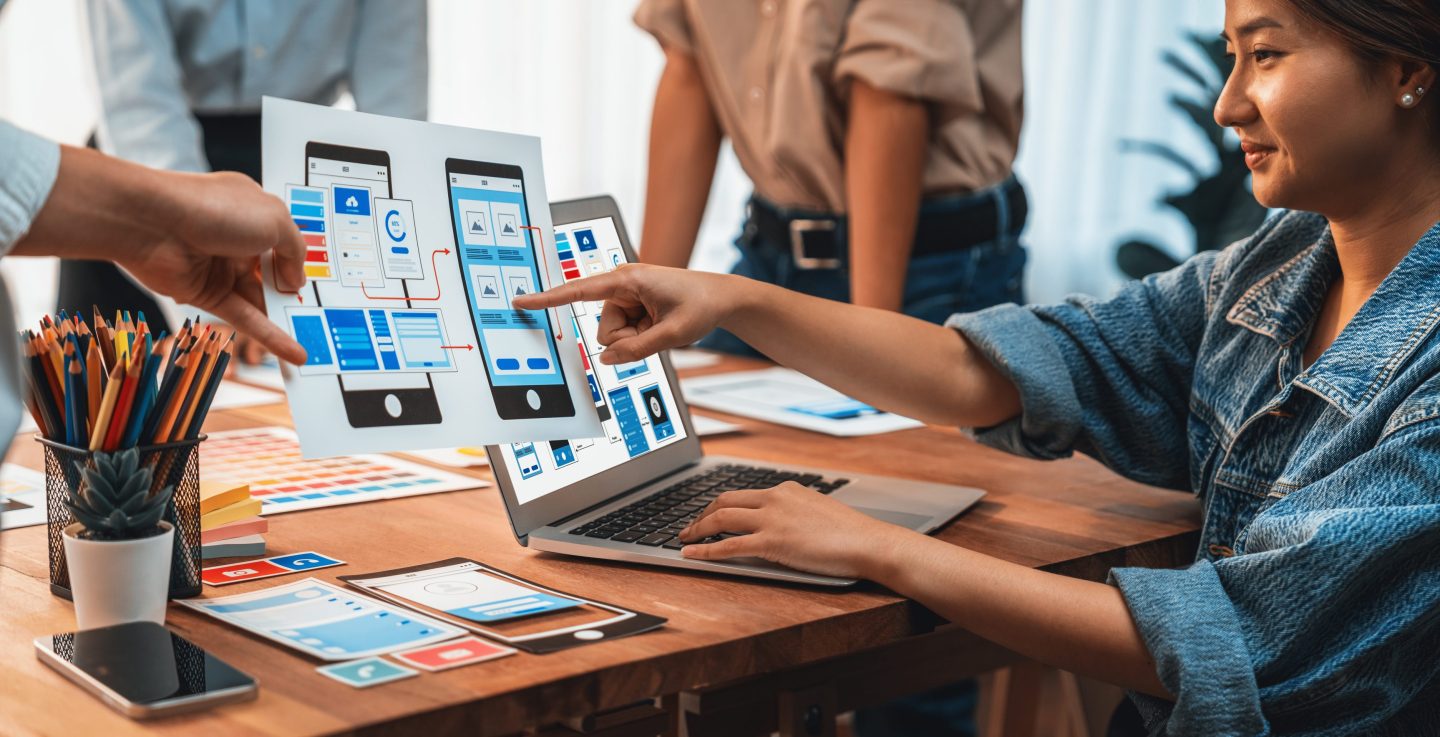 Developer team brainstorms UI and UX designs