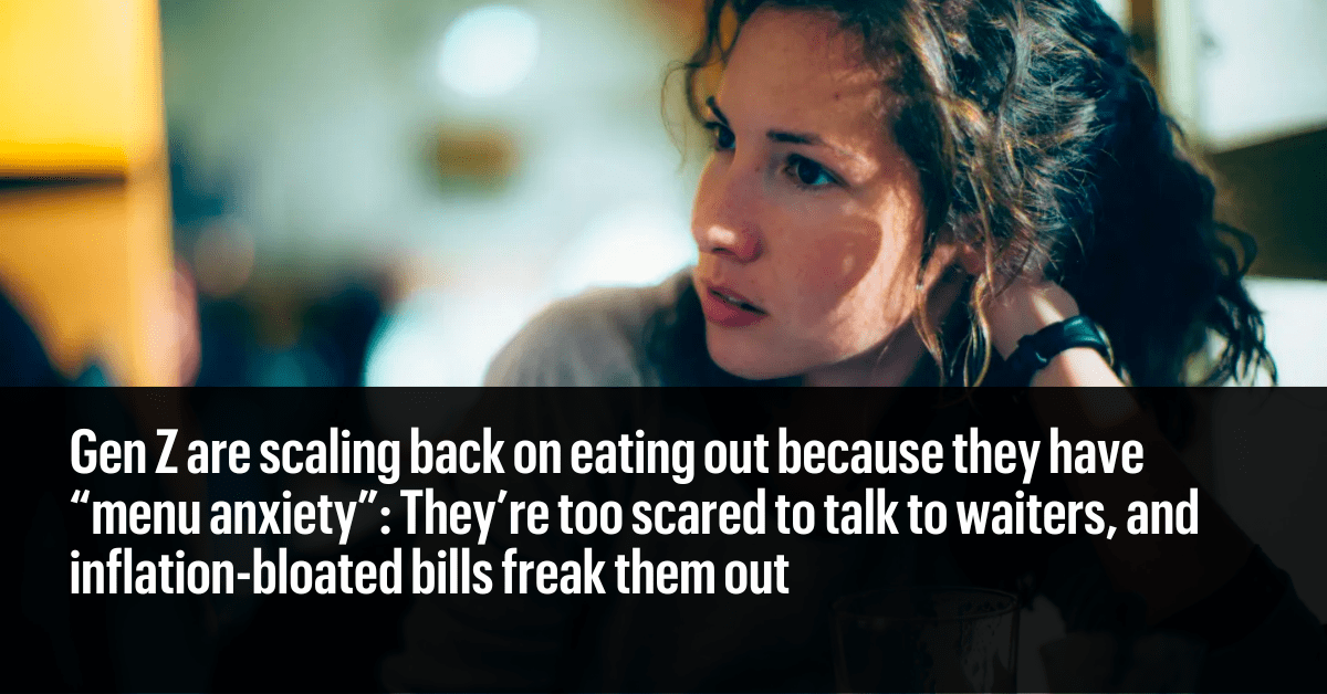 A young woman looking concerned in a coffee shop