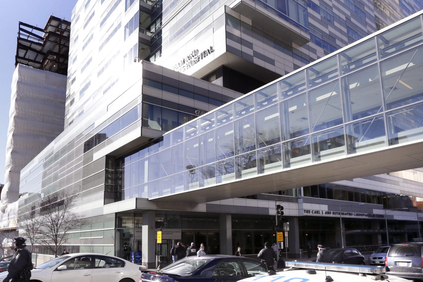 Pedestrians walk past the Shapiro Building at Brigham and Women's Hospital on Jan. 20, 2015, in Boston. Some women who spent months preparing for in vitro fertilization procedures have been left devastated after flooding from a burst water main at the hospital on Christmas Eve, Sunday, Dec. 24, 2023, disrupted services for about 200 IVF patients.