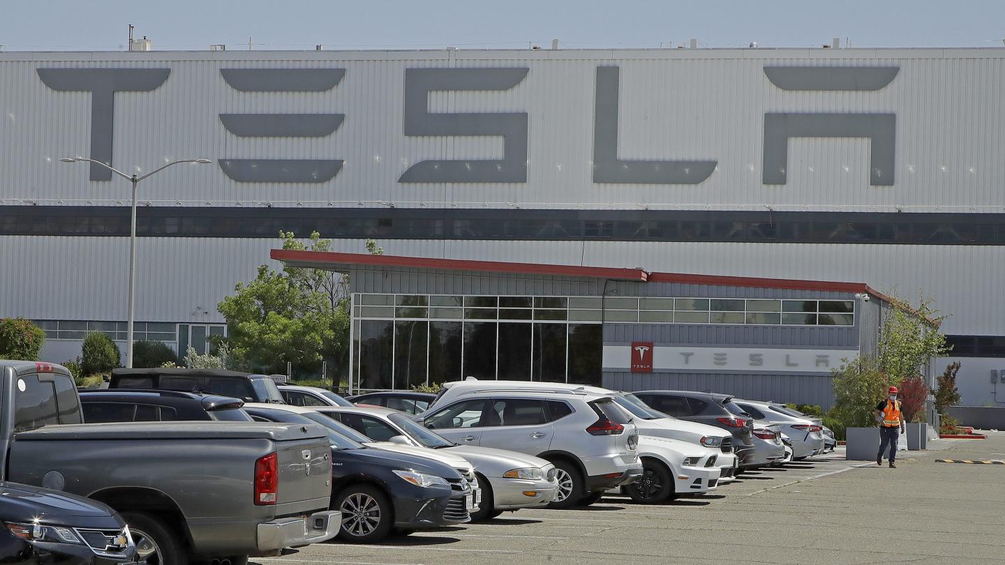 Tesla will raise factory worker wages as UAW tries to organize its EV plants
