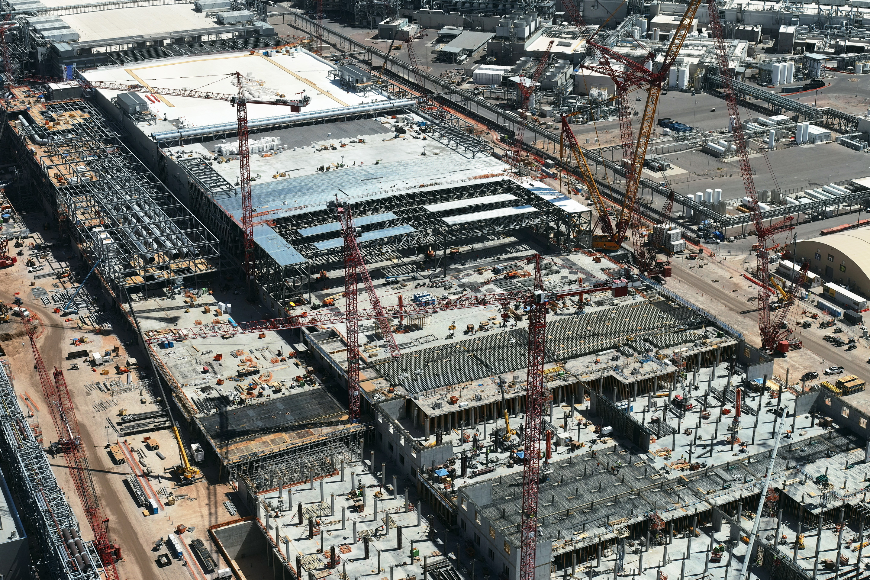 Intel is building two new chip plants near Phoenix, part of an industrywide building spree across the U.S.