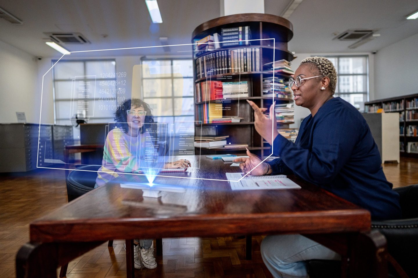 Students use an augmented reality device to study at library