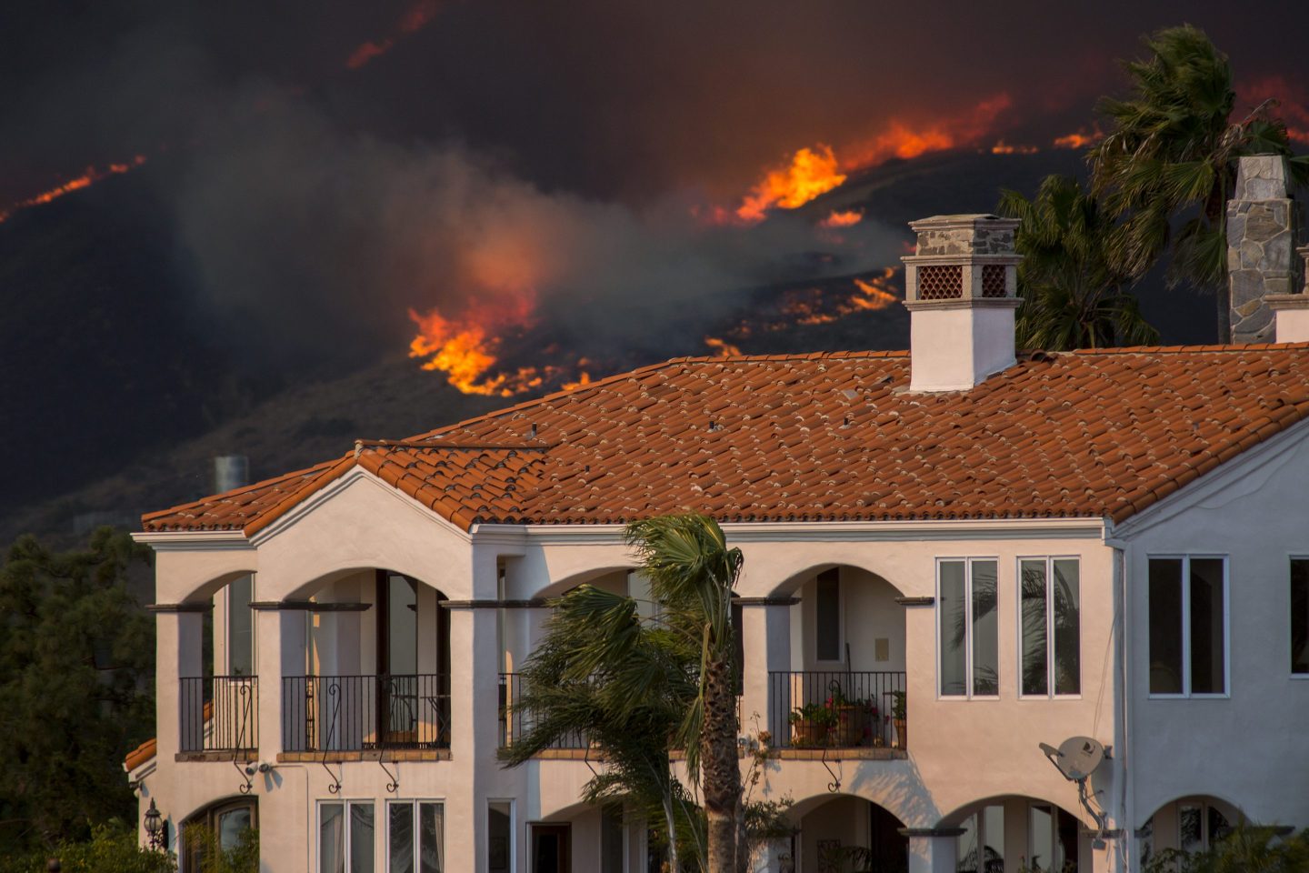 The Woolsey Fire approaching homes in November 2018 in Malibu, California. 