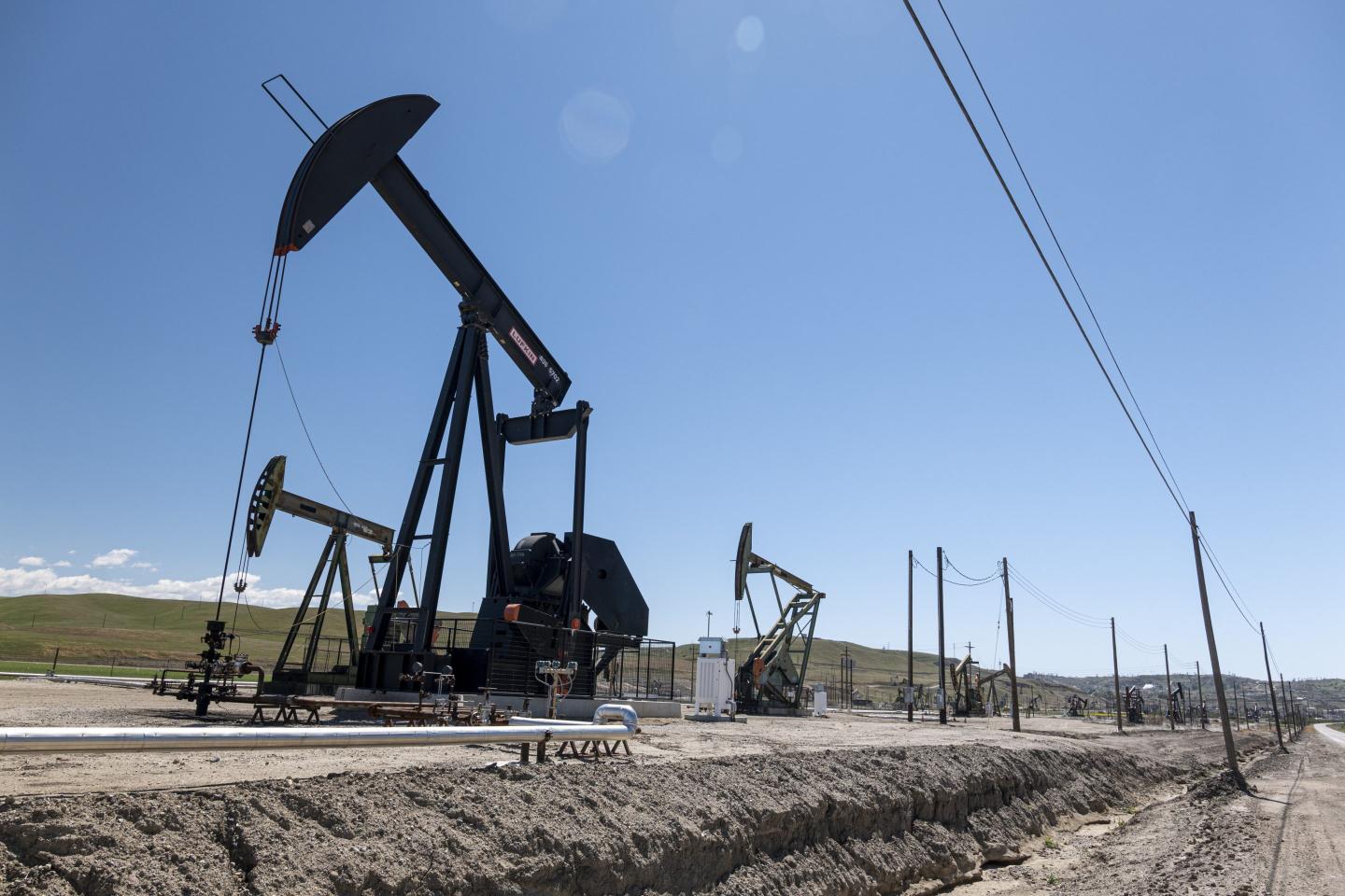 In the reeling energy sector, an unexpected OPEC production hike plus tariff fears send oil prices plunging 7%