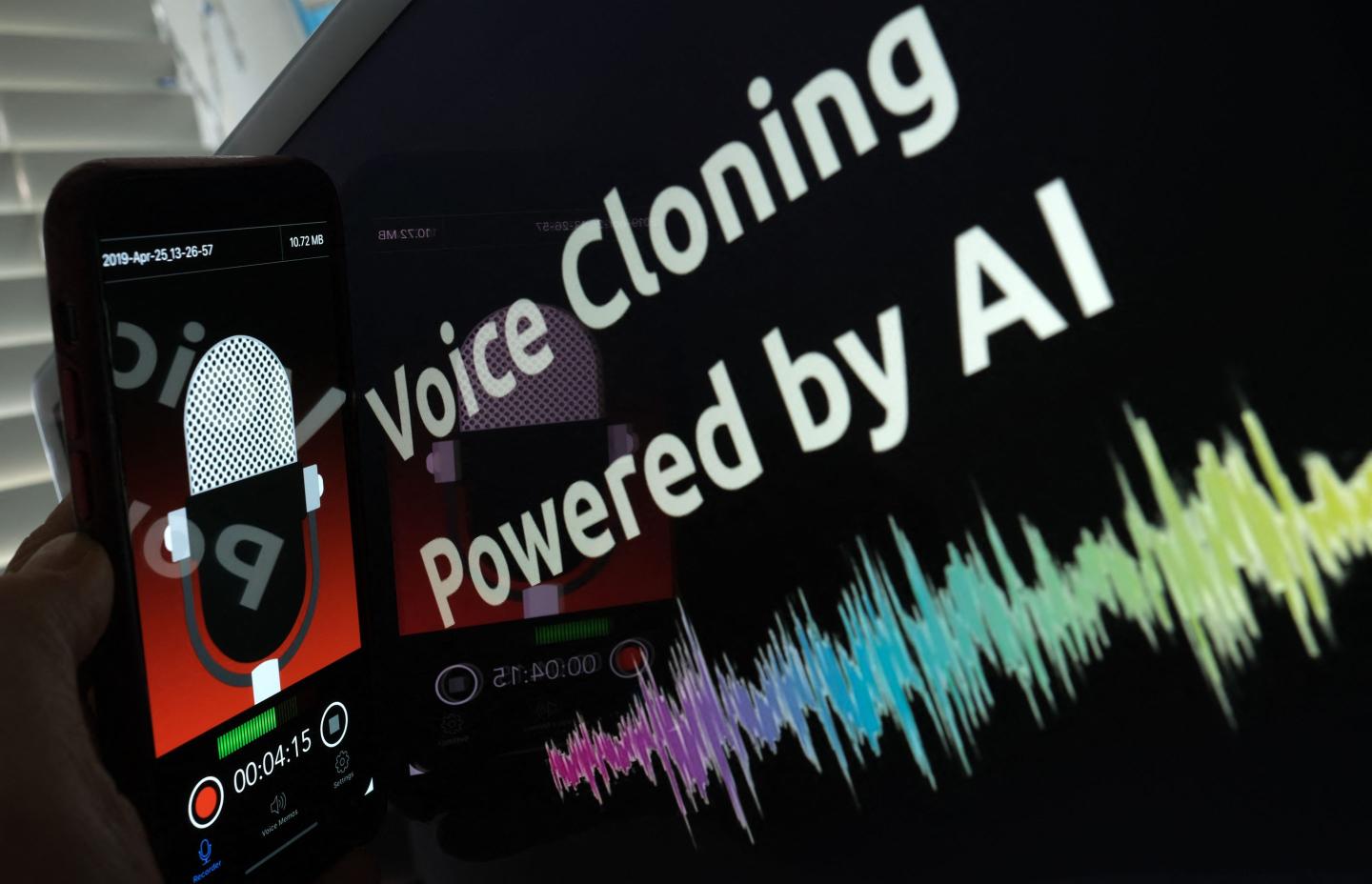 Image of a screen that says "Voice Cloning Powered by AI" and a graph of an audio signal.
