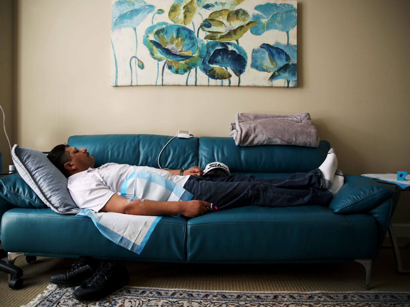 Dr. M. Rameen "Dr. G" Ghorieshi treats patient Ernie Ruiz while he sleeps during a visit to Palo Alto Mind Body in Palo Alto, Calif., on March 13, 2019. Ghorieshi gave his patient a ketamine IV at the clinic. A new ketamine-based nasal spray treatment was approved by the FDA in early 2019 to treat severe depression.