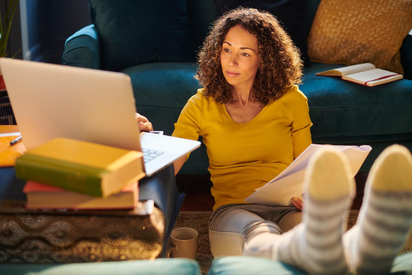 Woman working from home with her feet up