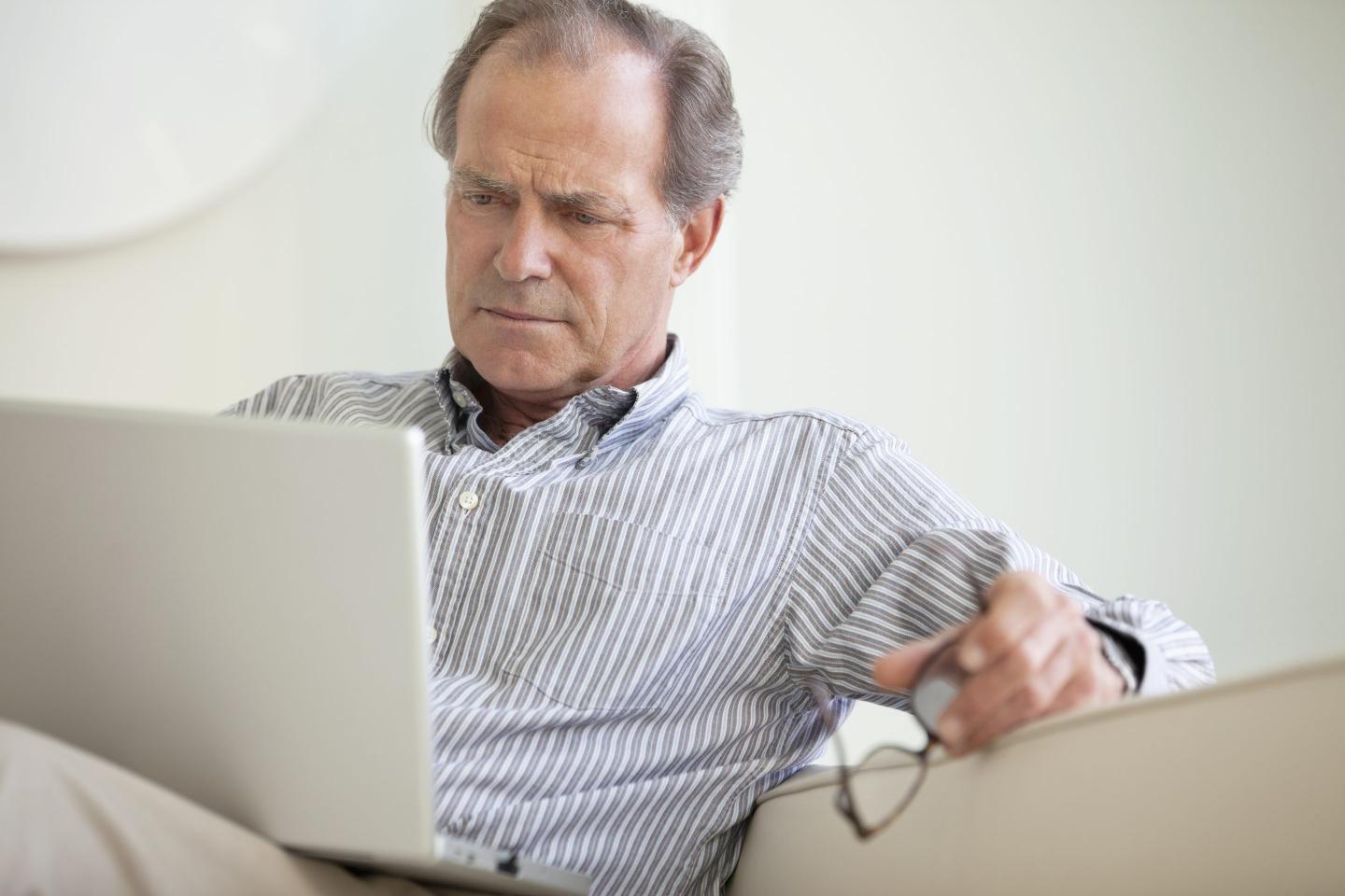 puzzled man at laptop