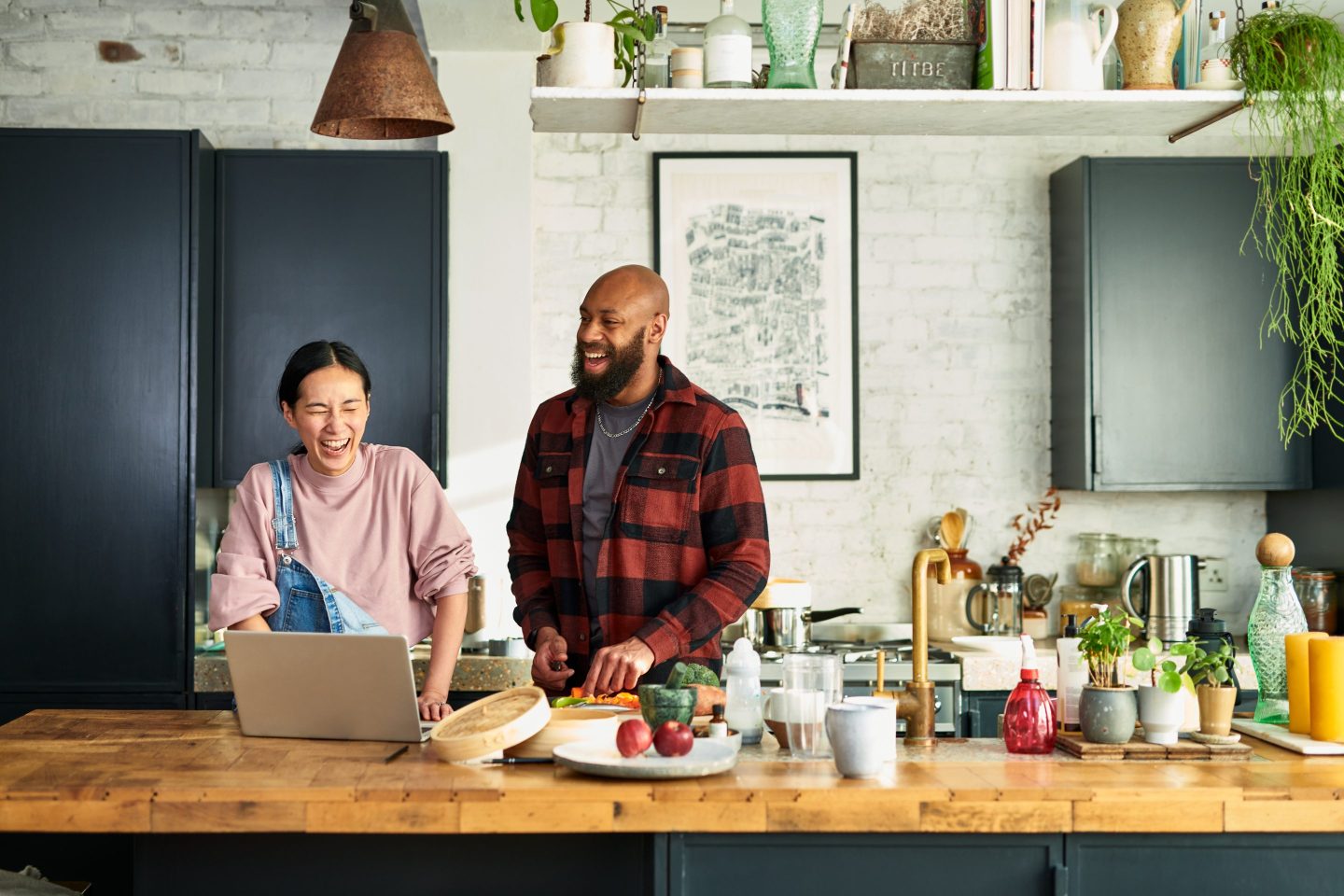 A woman and a man cooking together