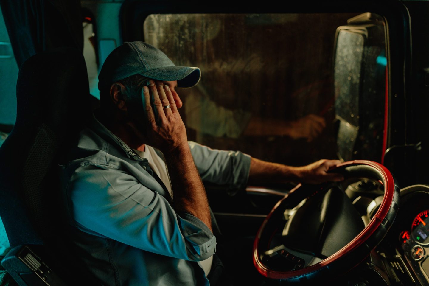 A sleepy truck driver on a night road.