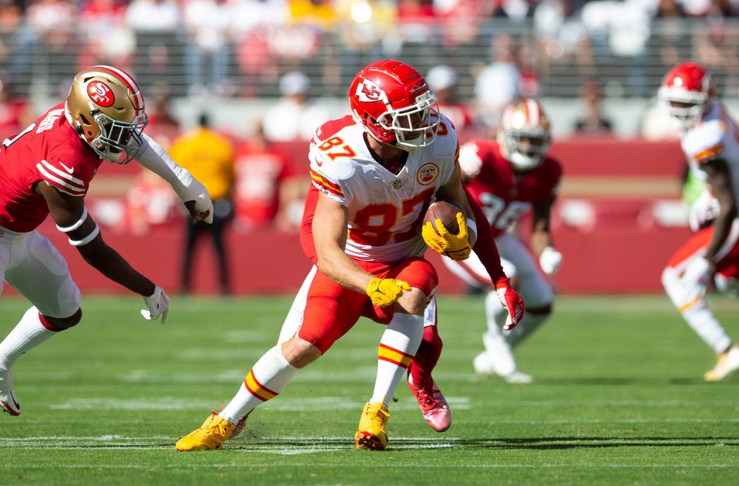 Travis Kelce, No. 87 of the Kansas City Chiefs, runs after making a catch