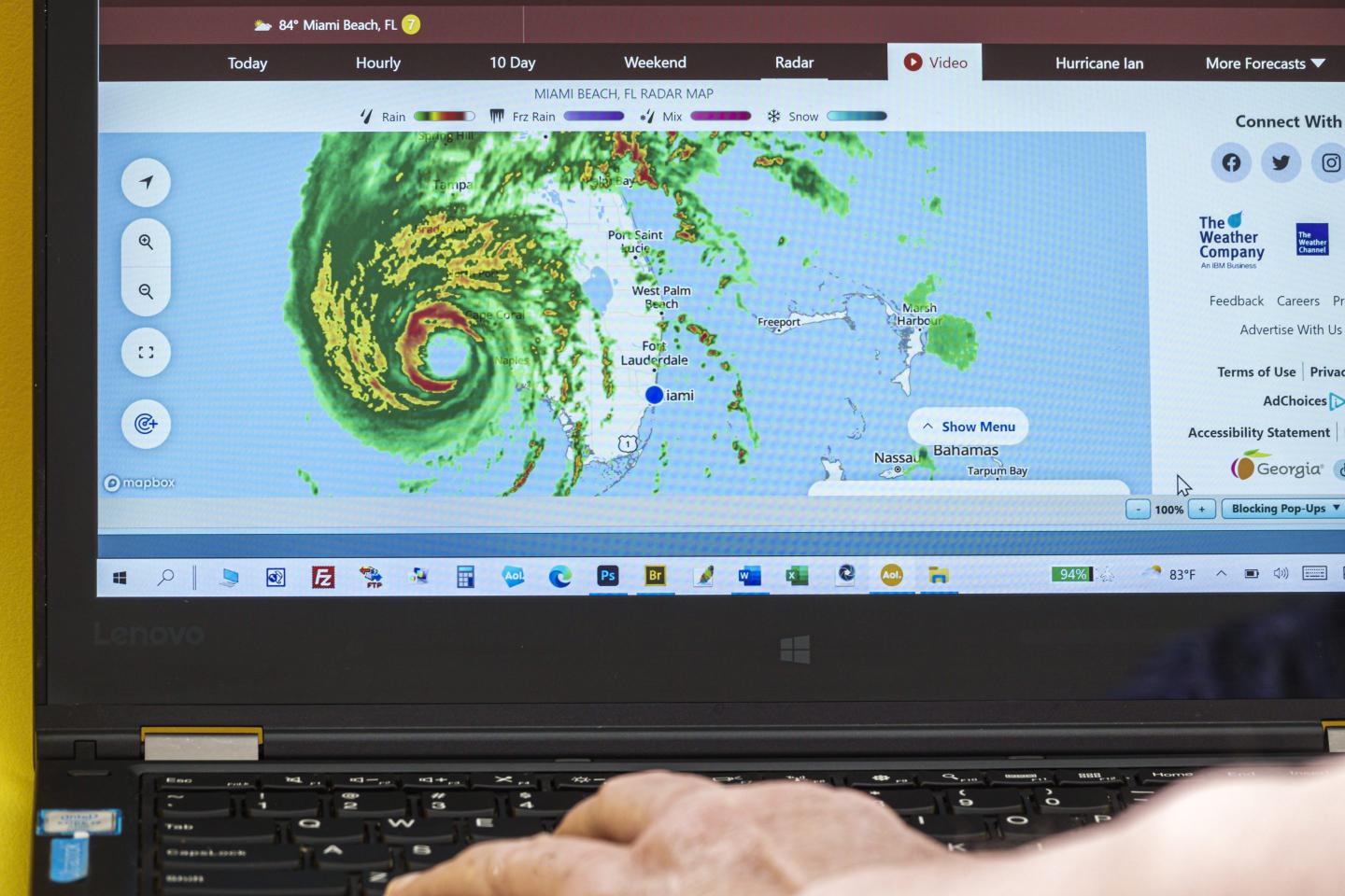 A weather radar screen with a hurricane on it.