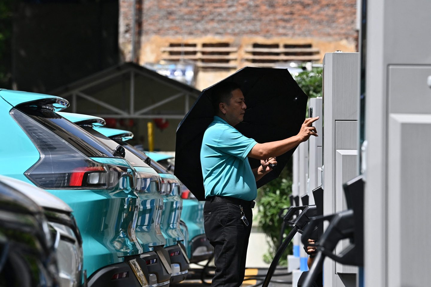 A driver charging a VinFast EV at a charging station in Hanoi on Oct. 5, 2023.