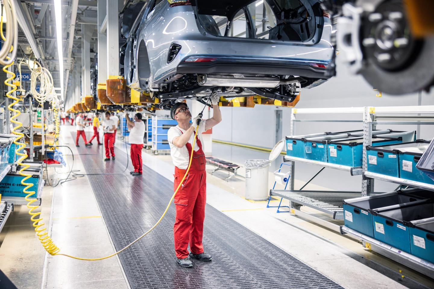Assembly line workers at the Kia Slovakia sro plant in Zilina, Slovakia.