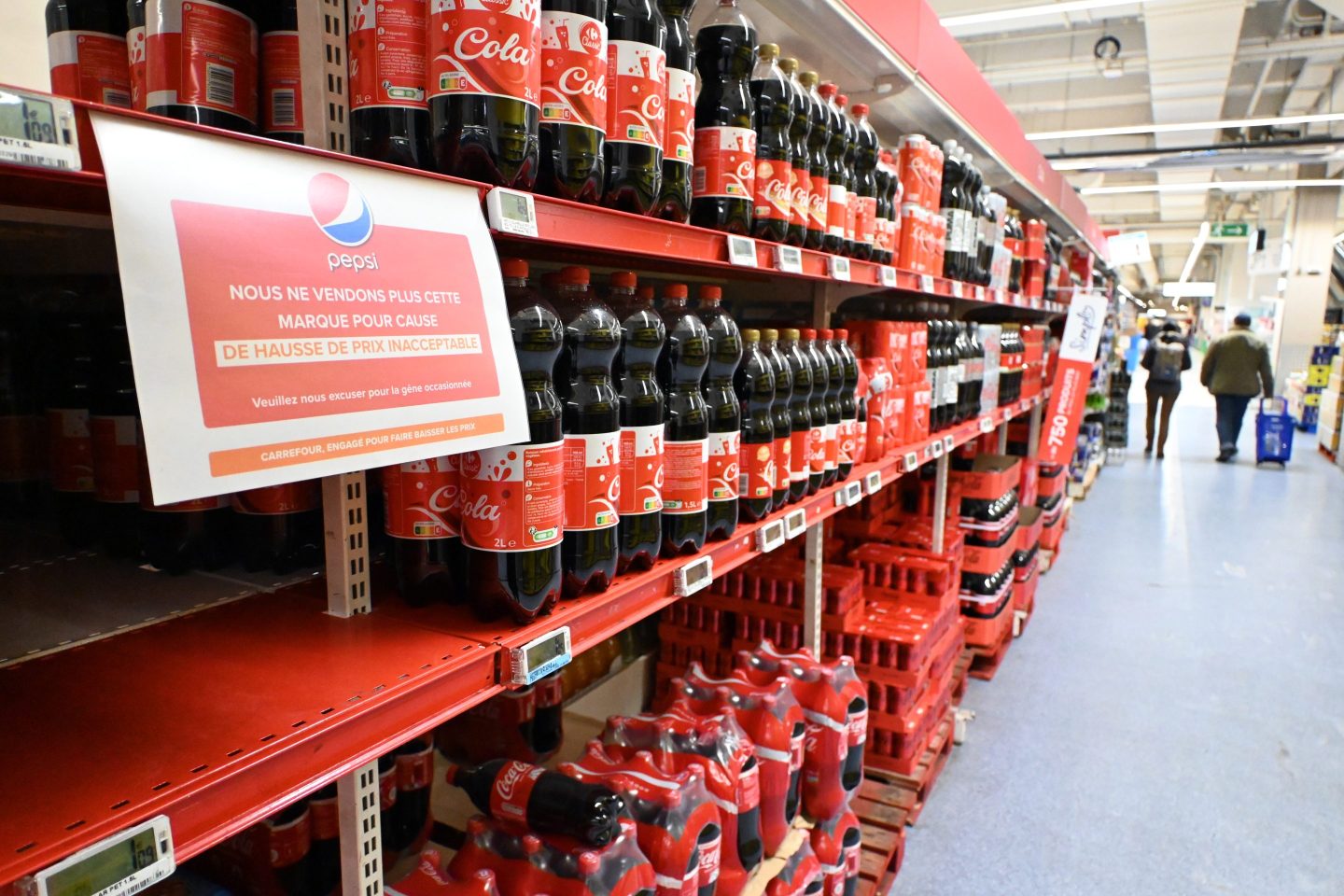 Photo of bare shelves at a Carrefour supermarket near Paris