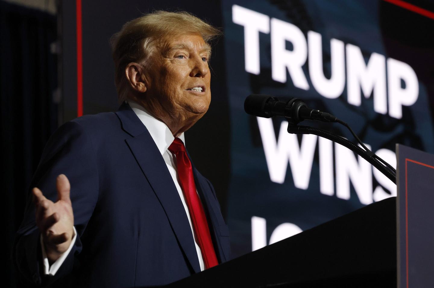 Former President Donald Trump speaks at his caucus night event at the Iowa Events Center