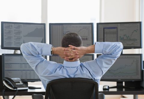 Super rich individuals analyzing stock market trends