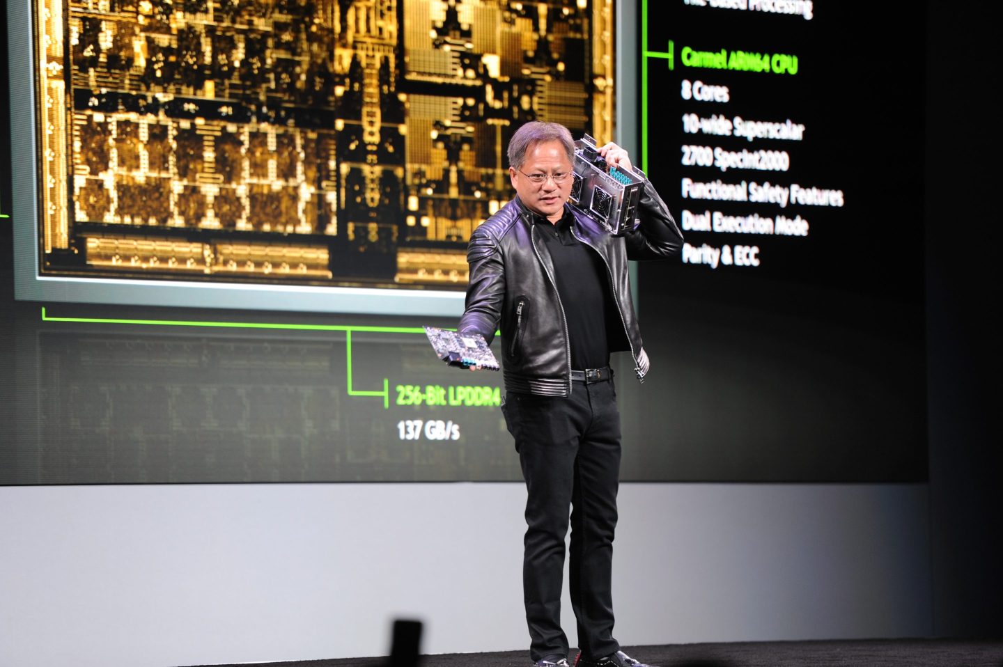 Jensen Huang, CEO of Nvidia, presents a prototype of the “DRIVE Xavier” for autonomous driving during CES 2018 in Las Vegas.