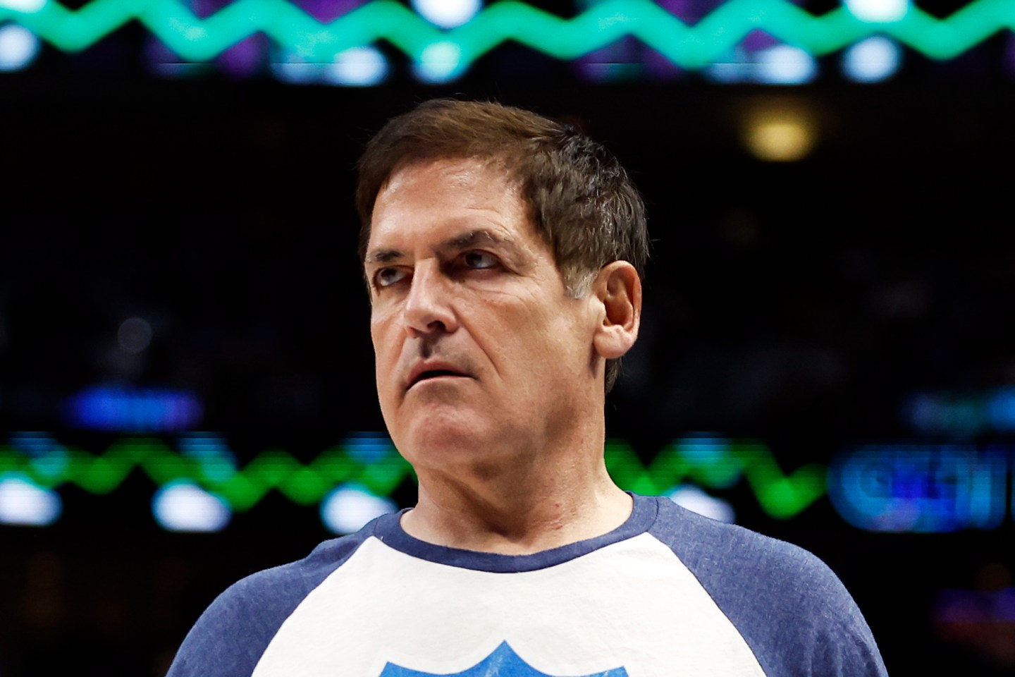 Dallas Mavericks owner Mark Cuban walks on the court during a timeout in the game against the Golden State Warriors.