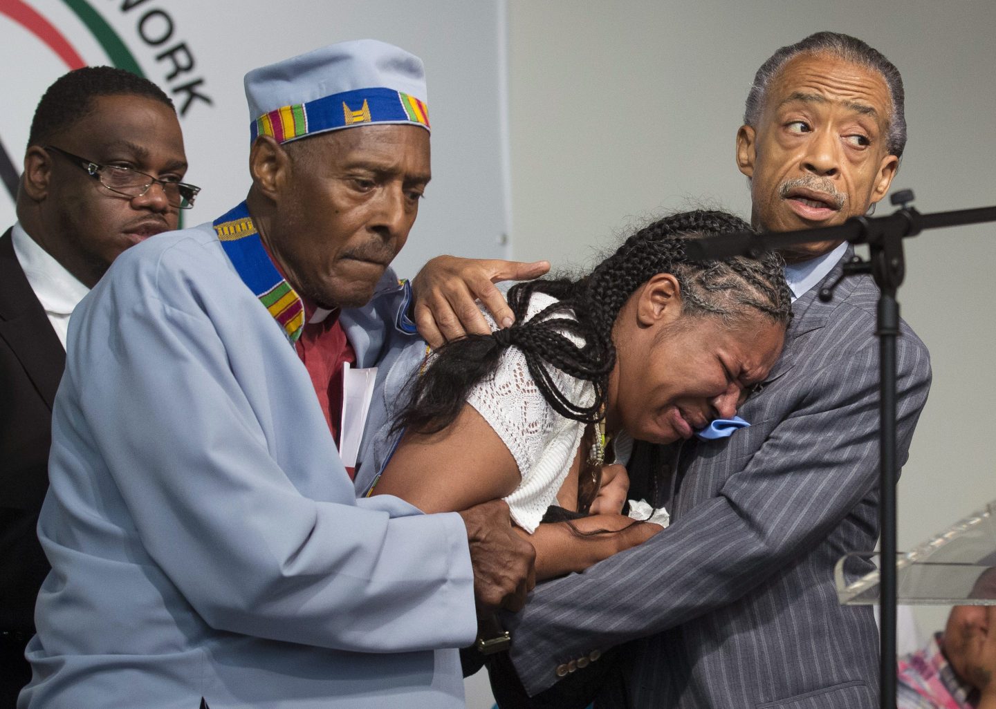 In this July 2014 file photo, Esaw Garner, center, wife of Eric Garner, breaks down in the arms of Rev. Herbert Daughtry and Rev. Al Sharpton, right, during a rally at the National Action Network headquarters for Eric Garner on July 19, 2014, in New York. Garner, 43, died during an arrest in Staten Island, when a plain-clothes police officer placed him in what appeared to be a chokehold while several others brought him to the ground and struggled to place him in handcuffs. A new study sheds light on the health impacts of racism on African Americans, including poorer sleep after police shooting of unarmed Black people.