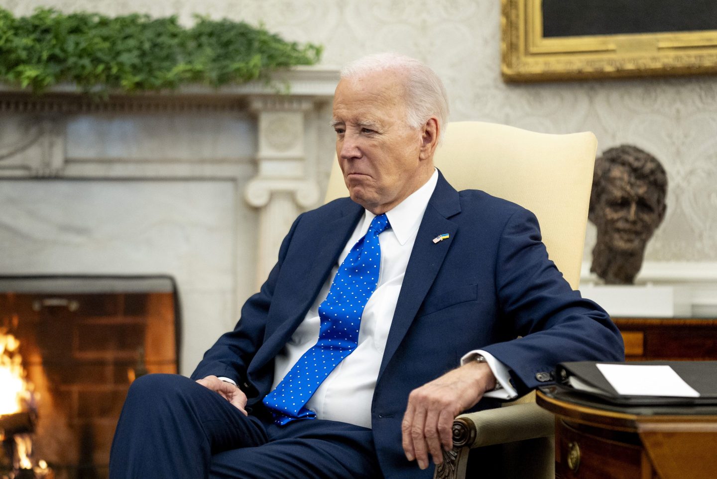 President Joe Biden sits in the Oval Office of the White House, on Feb. 9, 2024, in Washington.