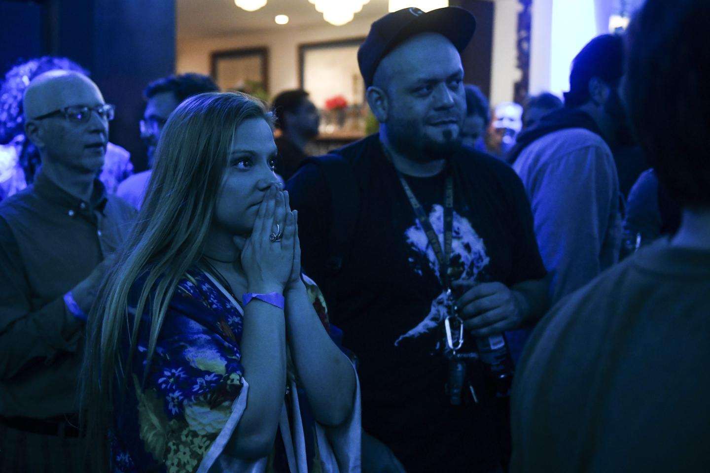 Psychedelic Club president Bethany Remington looks on as results come in at a watch party for the first bill in the nation that would decriminalize psilocybin mushrooms on May 7, 2019, in Denver. If the bill passes, it would make possession, use or cultivation of psilocybin mushrooms by people aged 21 and older the lowest law enforcement priority in the city. California lawmakers introduced a bipartisan bill on Tuesday to allow people 21 and older to consume psychedelic mushrooms under professional supervision.