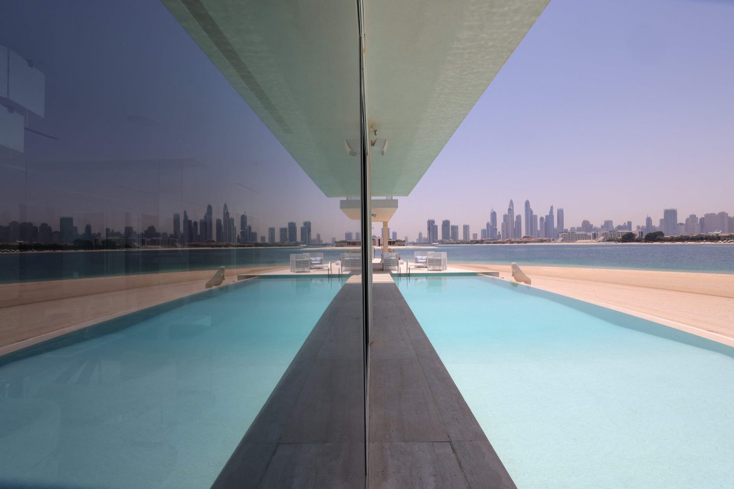 This picture shows the swimming pool of a luxury villa for sale on one of the Palm Jumeirah man-made island