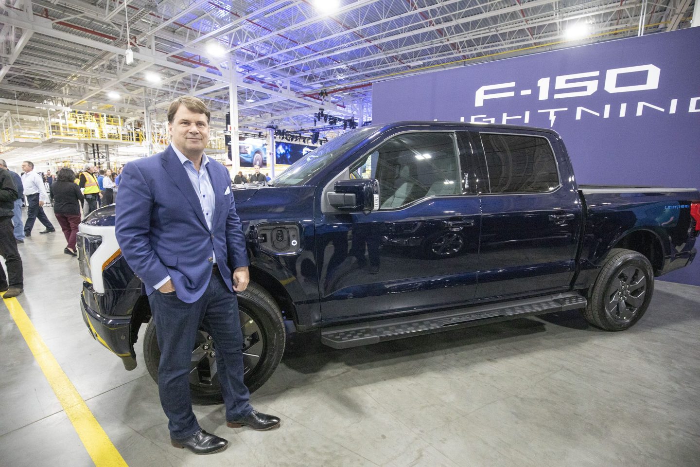 Ford CEO Jim Farley with an all-electric F-150 Lightning pickup truck.