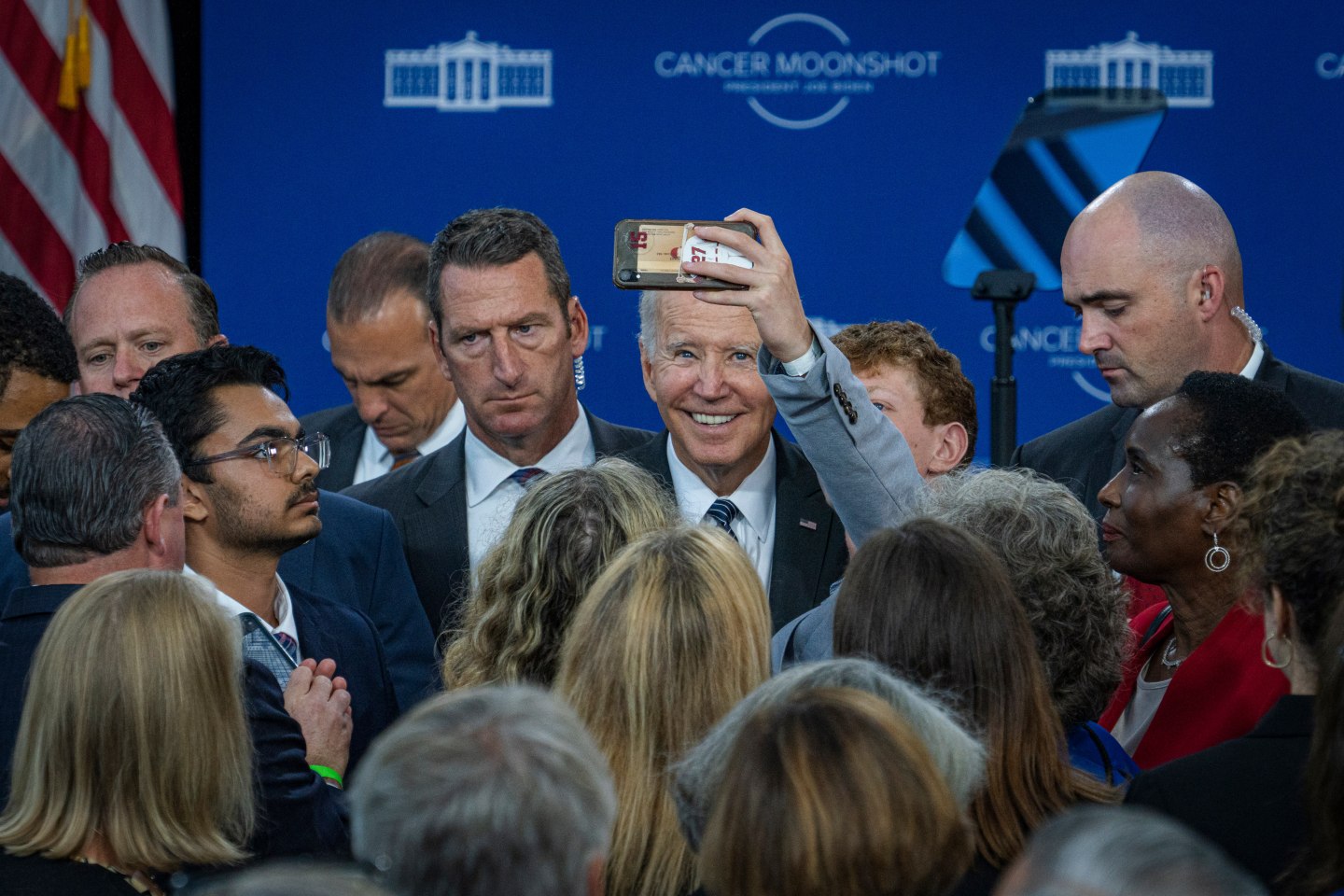 U.S. President Joe Biden takes a selfie photograph with an attendee at the John F. Kennedy Library and Museum in Boston, Mass., on Sept. 12, 2022. Biden's remarks on his administration's cancer moonshot, taking place on the 60th anniversary of President John F. Kennedy's "Moonshot" speech, are aimed at the goal of ending cancer.