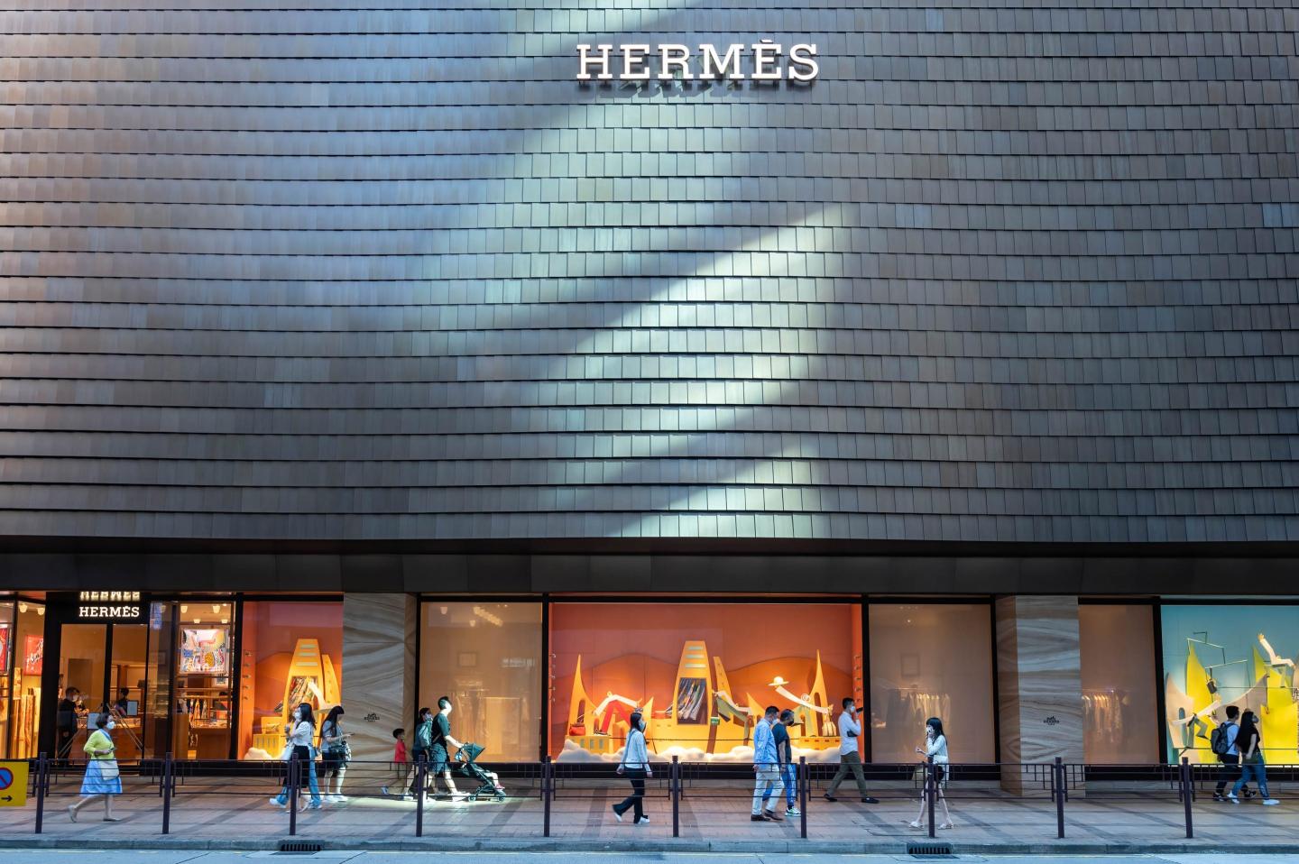 people seen walking outside a hermes store