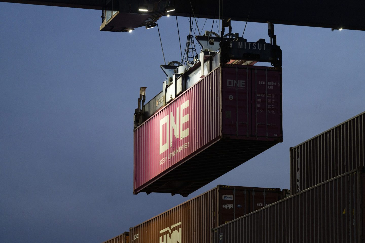 A crane moves a shipping container at the Port of Los Angeles, Feb. 16, 2023