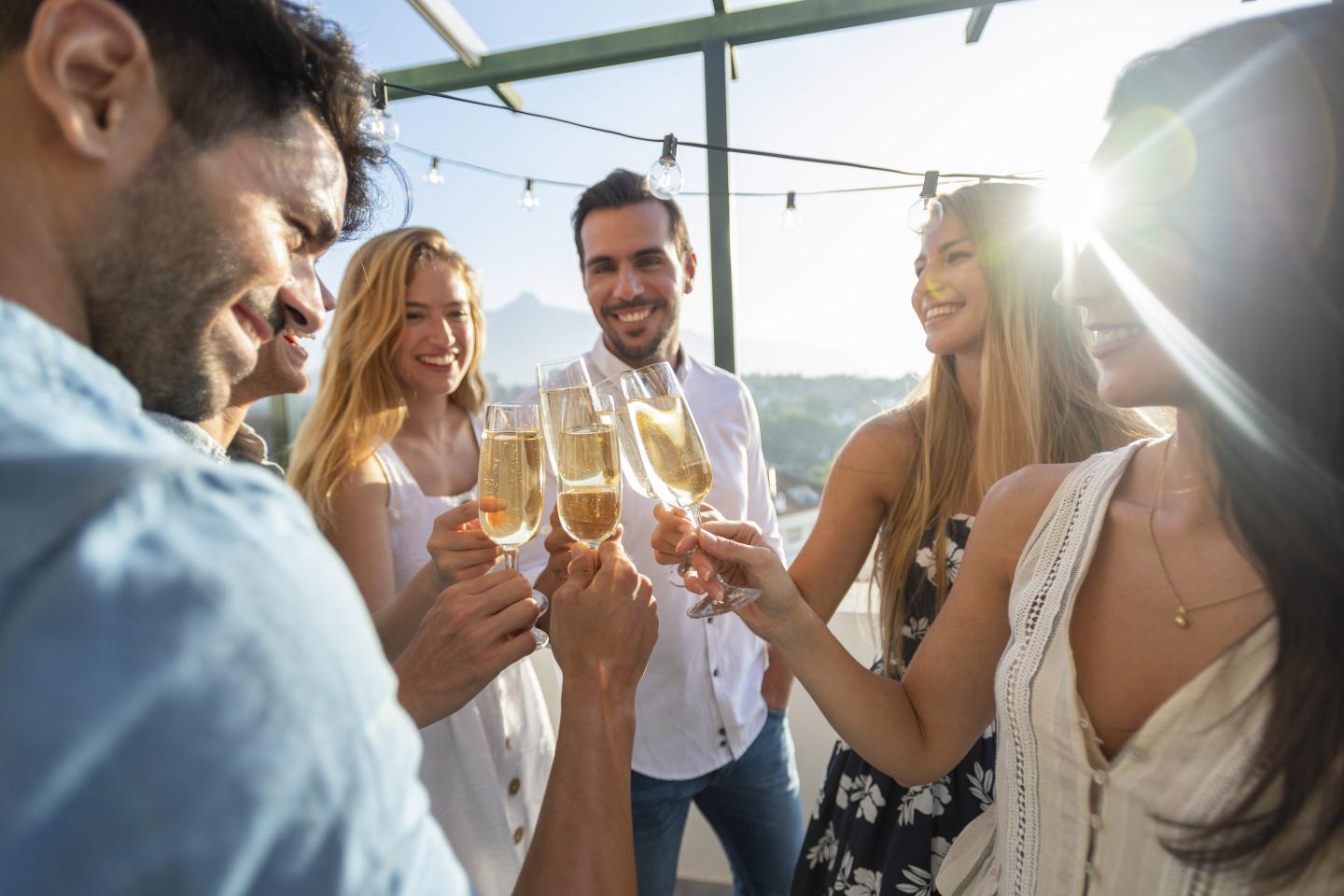 Group of millennials drinking champagne
