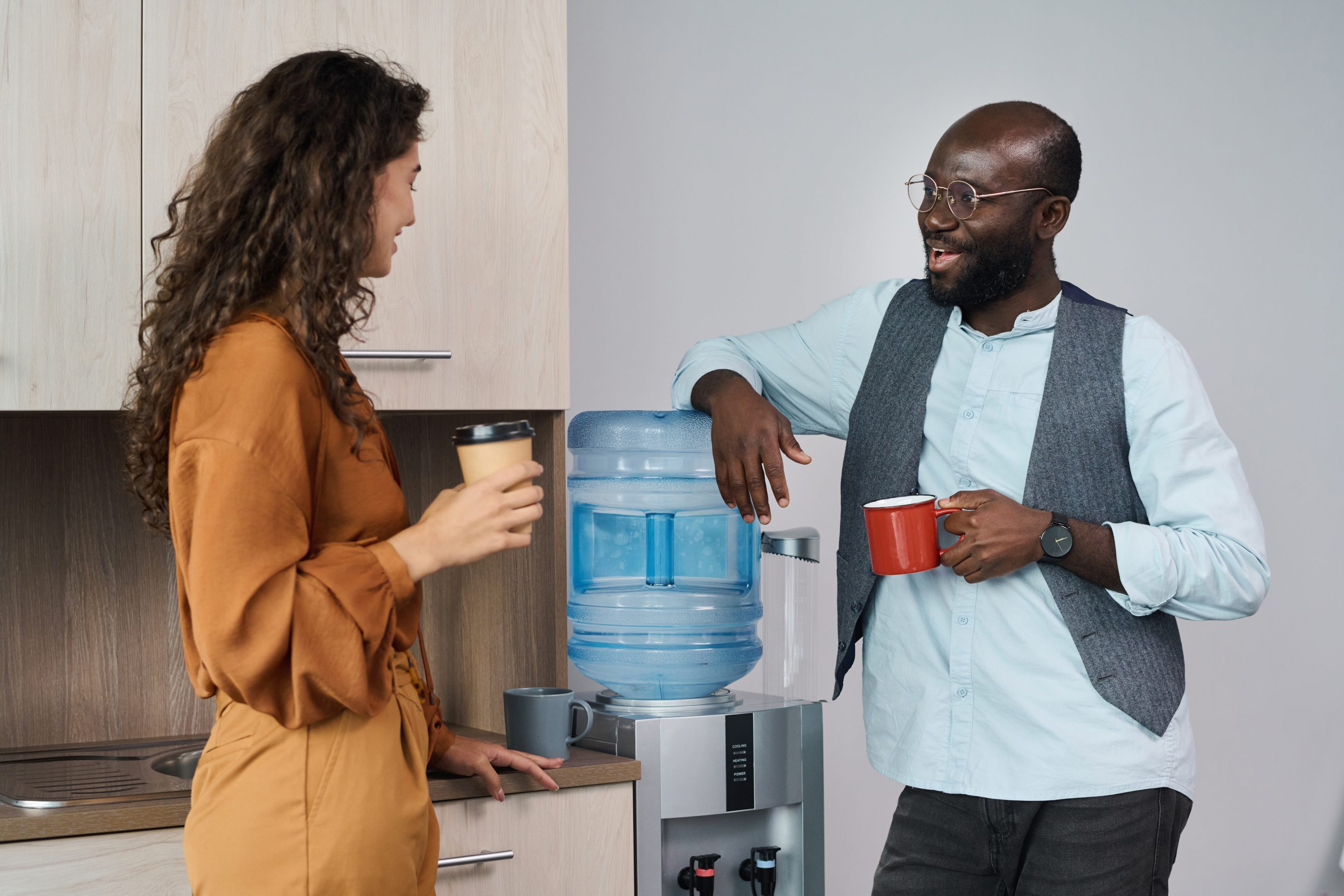 Workers chatting at the watercooler