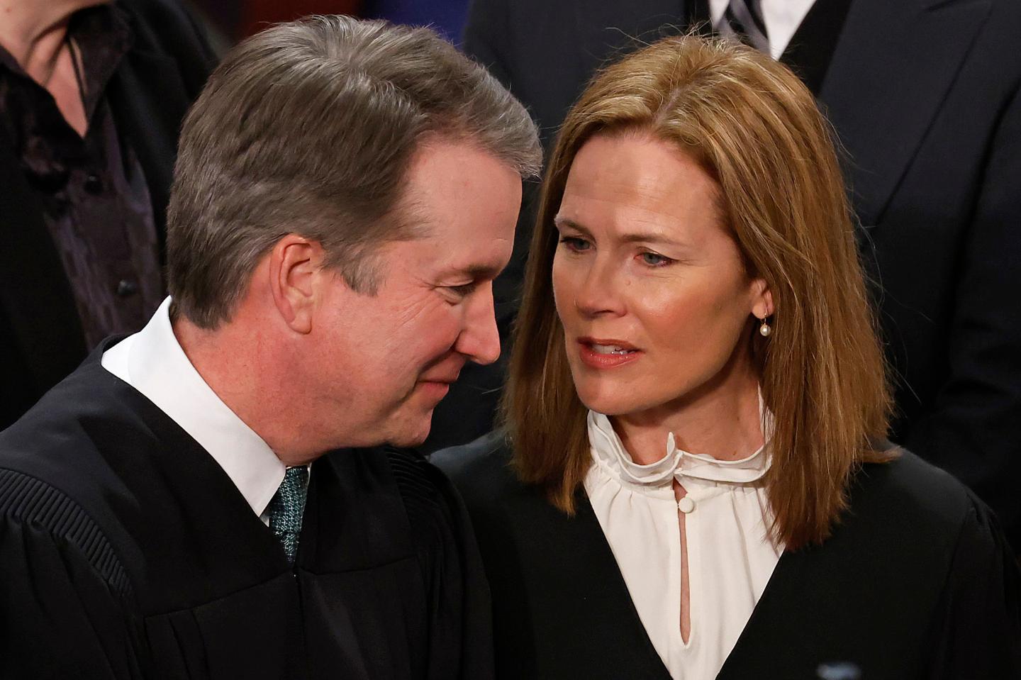 U.S. Supreme Court Associate Justices Brett Kavanaugh (L) and Amy Coney Barrett talk before President Joe Biden delivers the State of the Union address to a joint session of Congress in the House Chamber at the U.S. Capitol on February 07, 2023 in Washington, DC.
