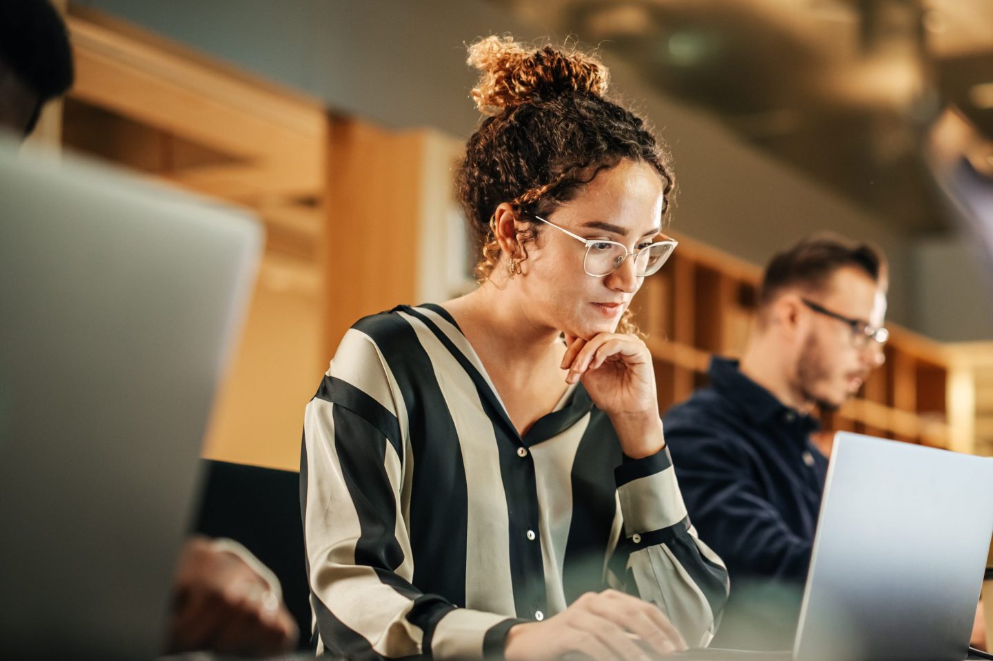 Woman working on a computer in an office