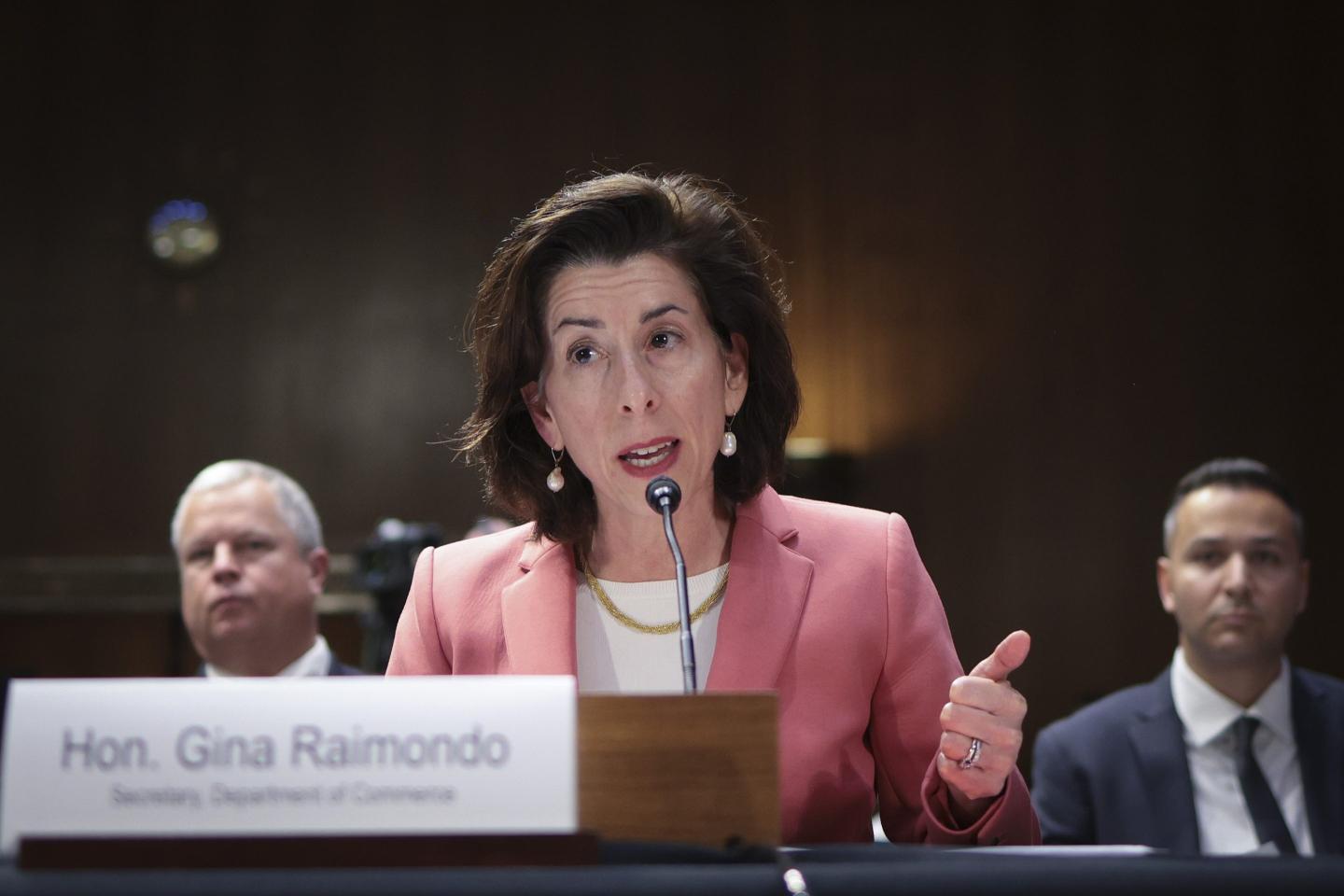 Gina Raimondo speaking at a podium
