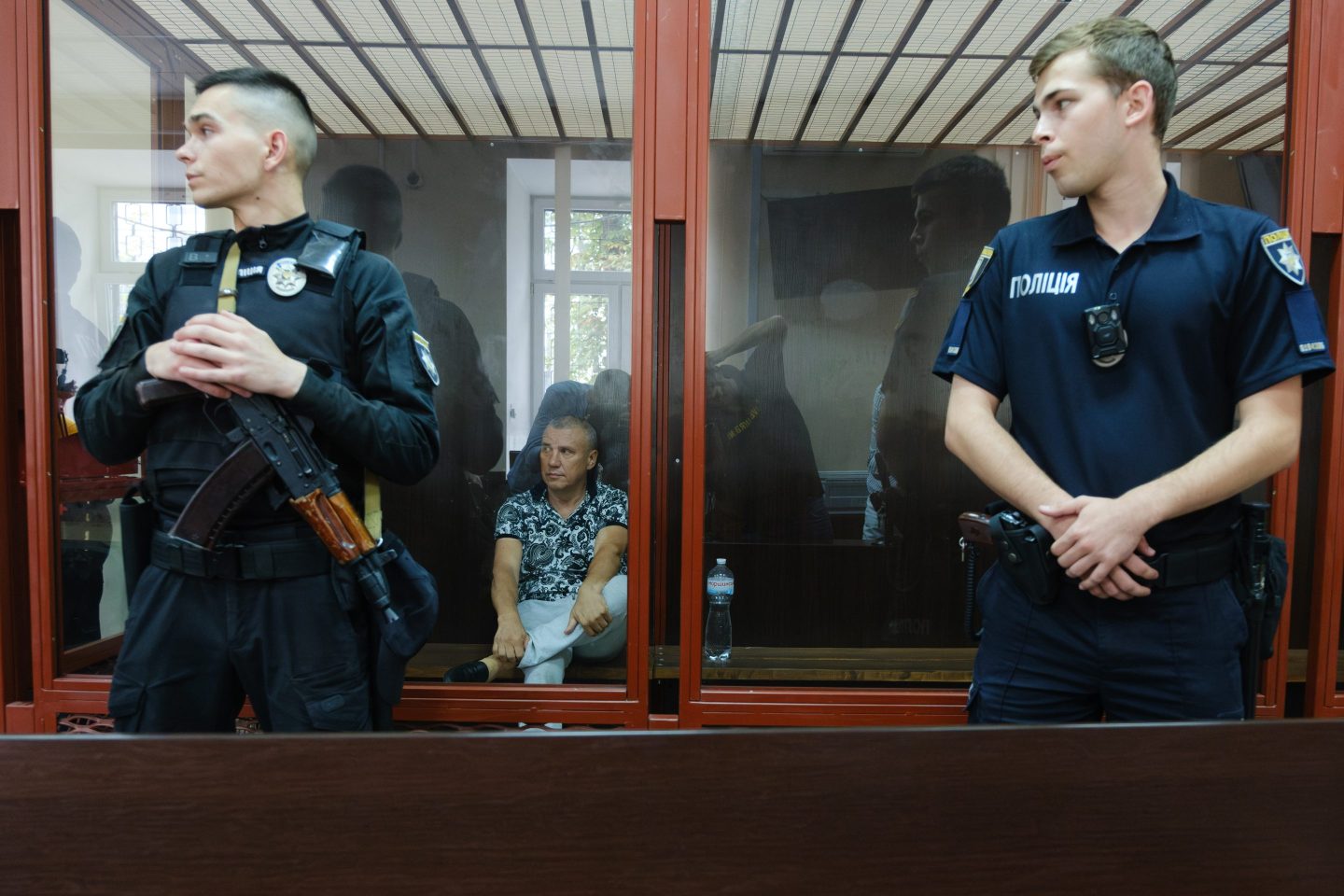 Policemen stand guard at the trial of former Ukrainian military commissar Yevhen Borysov in July.